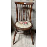 A mahogany single chair with woolwork seat and spindle back.Condition ReportWoolwork a/f. Marks to