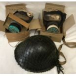 Military helmet and two respirator masks with original boxes.Condition ReportGood condition, minor