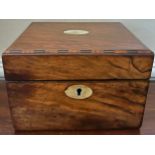 Mahogany tea caddy with mother of pearl to top, escutcheon and inlay to top edges. inner lift to