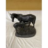 Horse and nursing foal sculpture with stamped signature. 29.5cms h x 36cms w. Stamp to base 1966.