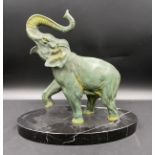 A spelter elephant on a black marble base. Approx 27cm h x 32cm w.Condition ReportGood condition.