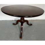 A tilt top mahogany table. 83cm d.