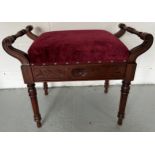 An Edwardian upholstered top piano stool with lift up lid. 65 w x 35 d x 53cm h.