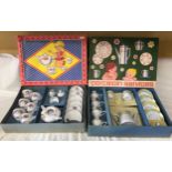 Two children's pottery tea sets in original boxes, one floral 15 piece and one yellow and blue 11