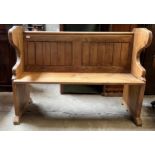 A pine settle with slatted back and club decoration to side. 127 w x 49cm x 93cm h.Condition