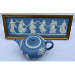 A Wedgwood jasperware framed plaque 18 x 48cm together with a Wedgwood teapot.Condition ReportBoth