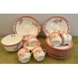 A 19thC part tea service to include 2 large plates, 12 tea plates, 4 saucers, slop bowl and 6 cups.