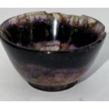 A small turned Blue John bowl, raised on a slight foot. 4.7cm w.Condition ReportVery badly damaged.