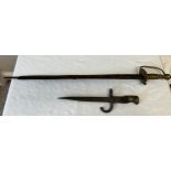 A vintage sword with leather scabbard and a dagger.Condition ReportBoth a/f.