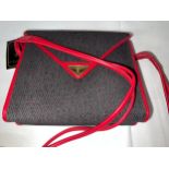 A 1980's Yves Saint Laurent red part leather two section handbag. 23 w x 20cm h.Condition