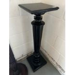 A painted black wooden torchere. 98cm h. Top 27cm square.Condition ReportGood condition.
