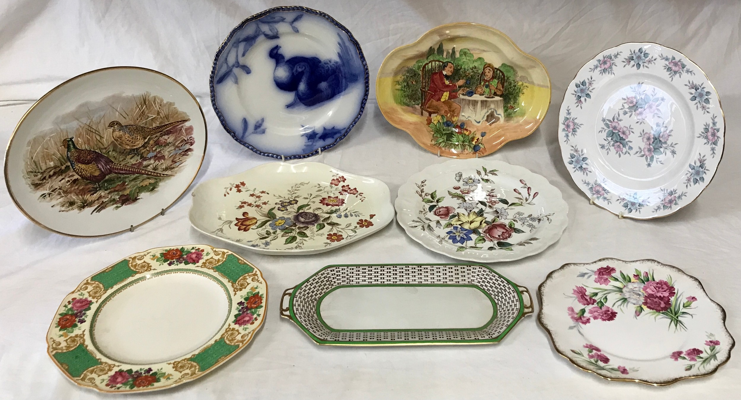 A collection of 9 plates of various sizes and design by Royal Doulton, Crown Ducal, Booth, Spode