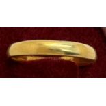 A gold wedding band. Size V. 5.4gm Tests as 22ct.Condition ReportMarks rubbed.