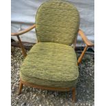 A vintage Ercol 203 armchair with original cushions.Condition ReportWebbing stretched.