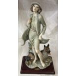 A Florence figurine of a lady and a dog 36cms h by Giuseppe Armani.Condition Reportslight wear to