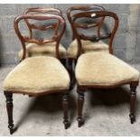 Four Victorian Rosewood balloon back dining chairs on turned front legs.Condition ReportSome water