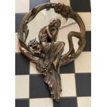 A 'Veronese' Art Nouveau style mirror of a seated lady and flowers. 70 x 46cm at widest point.