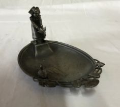 A WMF dish depicting a lady releasing a duck into a pond. 15 l x 9.5cm w.Condition ReportWith