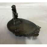 A WMF dish depicting a lady releasing a duck into a pond. 15 l x 9.5cm w.Condition ReportWith