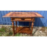 A continental side table with dropped leaves and drawer to front. 64 w x 48 d x 68cm h - 98cm with