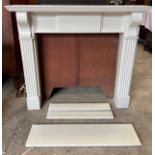 A modern fire surround and insert with stone insert. Surround external 128.5 w x 24 d x 114cm h.