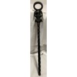 African ebony carved walking stick, twist stem, elephant and lions carving. 94cm l.Condition