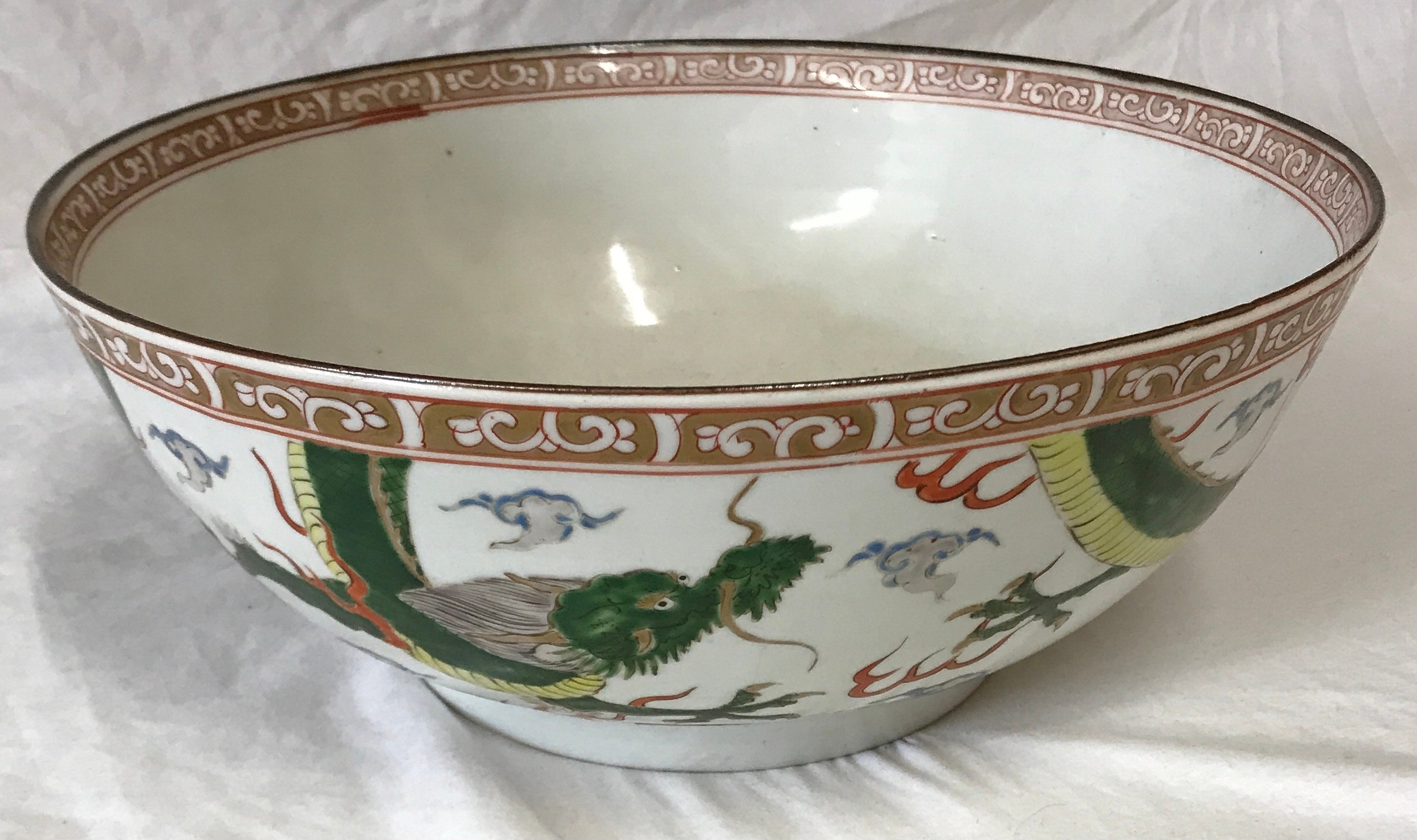 Chinese bowl depicting Green Dragons 31cm d 12cm h.Condition ReportHairline crack to rim of bowl.