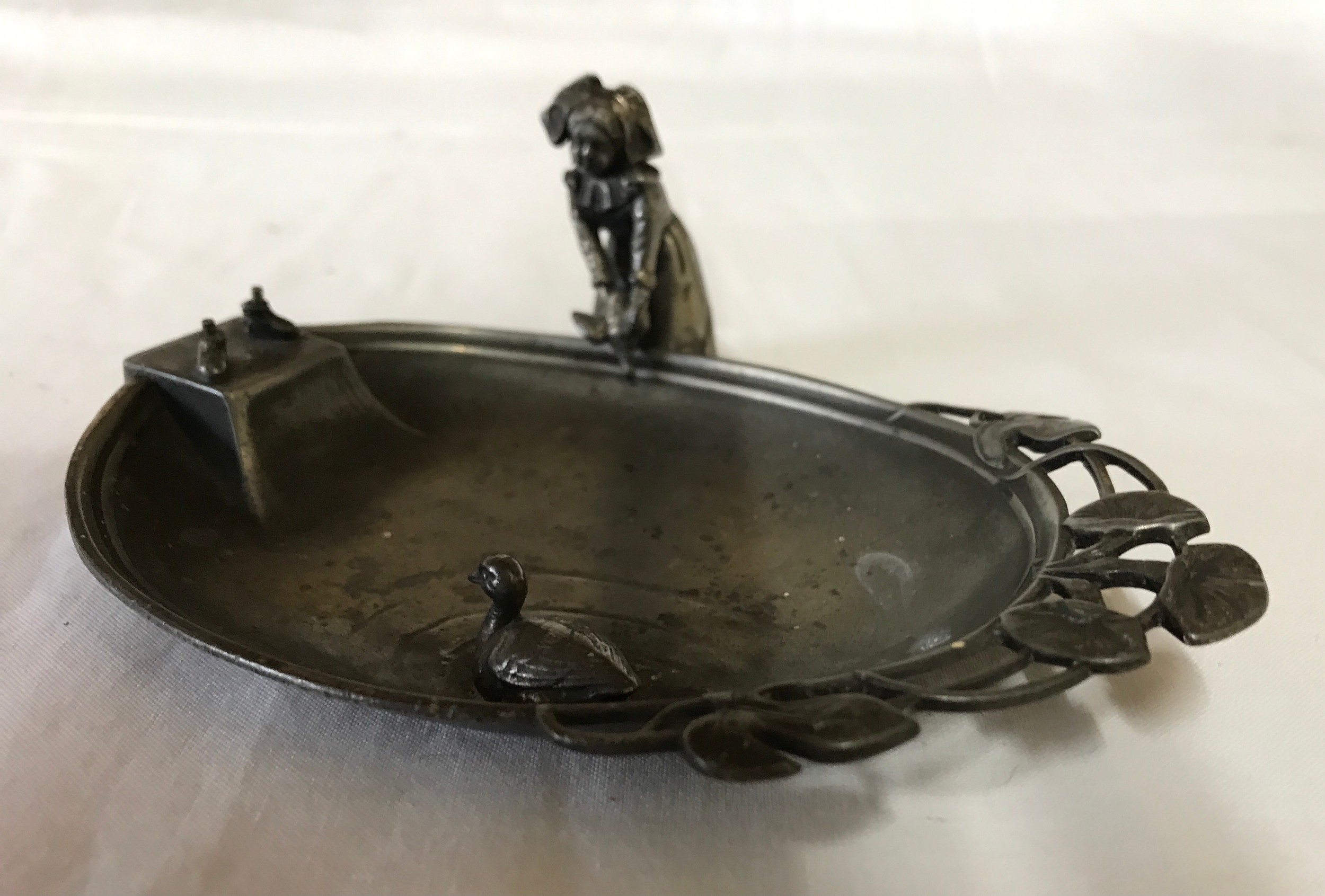 A WMF dish depicting a lady releasing a duck into a pond. 15 l x 9.5cm w.Condition ReportWith - Image 3 of 3