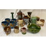 A large collection of Studio pottery to include : C H Brannam Barum mottoware fish jug, dated