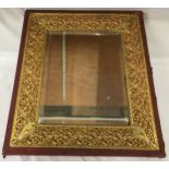 Cloth bound, wood and decorative brass framed bevelled edged wall mirror. Frame size 57cms h x 50cms