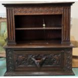 Carved oak cupboard, single door to base, shelf to top section, slot carved to top surface 71cm w