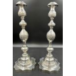 A pair of silver Jewish Sabbath candlesticks, London 1929 with detachable sconces, engraved and
