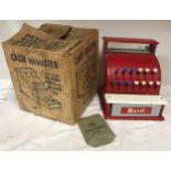 Merit tinplate cash register with original box 19cms h x 17cms w x 19cms d.Condition ReportPlaywear,