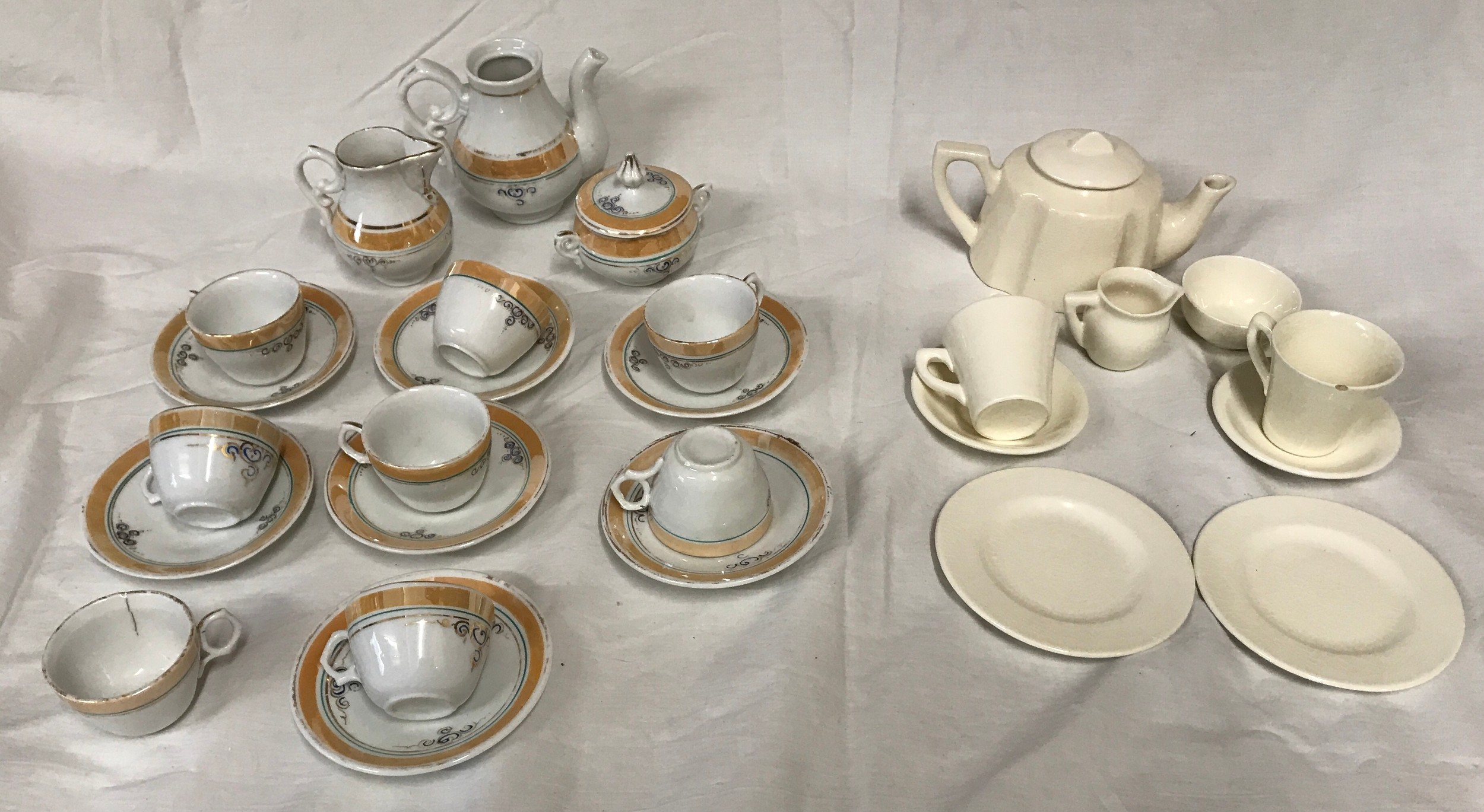 Two children's tea sets, one brown and gilt rimmed 18 pieces and one white pottery 9 pieces tea