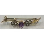 A 9ct gold and amethyst seed pearl brooch. Weight 1.5gm.Condition ReportLacking one pearl.