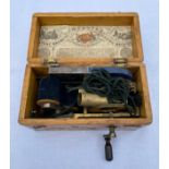 A Vintage Magneto Electric Machine for nervous diseases in original wooden case.Condition ReportWith