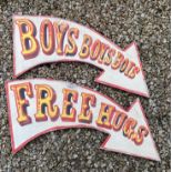 Two vintage style comical circus arrow signs 'Free Hugs' and 'Boys Boys Boys', by repute hand cut