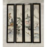 Four framed Chinese ceramic tiles depicting mountain scenes. Each frame consisting of 3 tiles. Frame