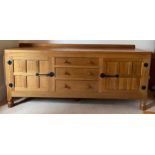 A Robert 'Mouseman' Thompson sideboard with adzed top comprising two cupboards with 3 central