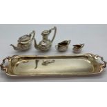 Miniature silver tea service on tray, London 1976, maker Da-mar Silverware. 65gm total weight.