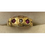 Eighteen carat gold ring set with 2 rubies. Weight 2.8gm.Condition ReportMissing central stone.