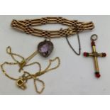 Yellow metal bracelet, yellow metal and coral crucifix, heart shaped purple stone pendant in 9ct