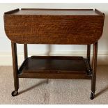 A vintage oak tea trolley with removable tray to base on castors. 69 w x 37 x 65cm h.Condition