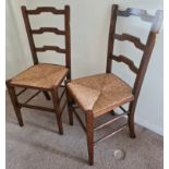 A pair of rush seated chairs. 86 h x 38 w x 36cm d.