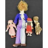 Four bisque headed dolls including a wind up musical clown 50cm h.