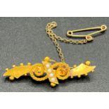 A 15ct gold bar brooch set with seed pearls. Total weight 3.4gm.Condition ReportGood condition.