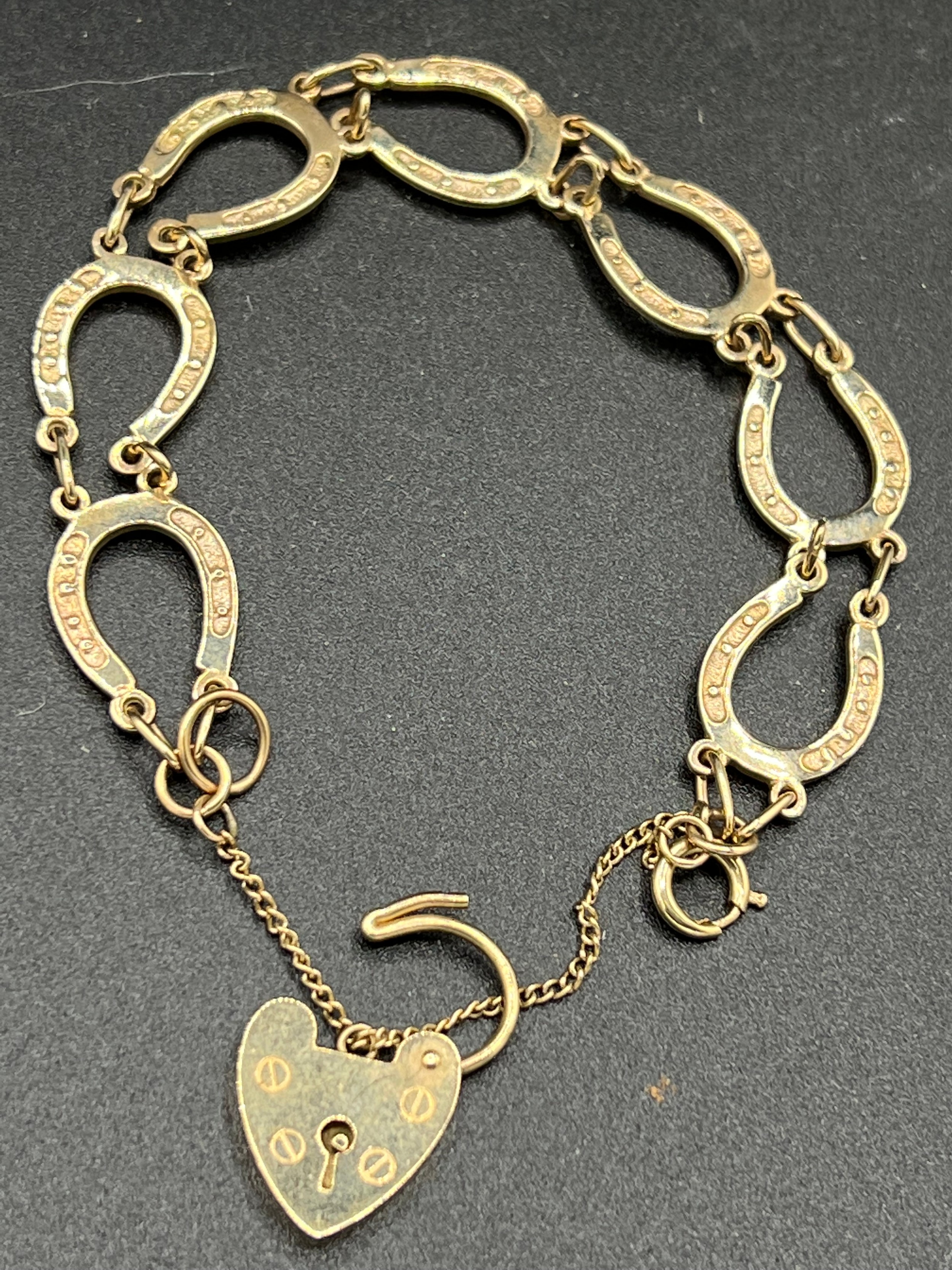 A 9ct gold horseshoe bracelet. Weight 11.9gm.Condition ReportGood condition. - Image 2 of 3
