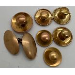 Six gold collar studs including one 15ct and a 9ct gold cufflink. 9gm total.