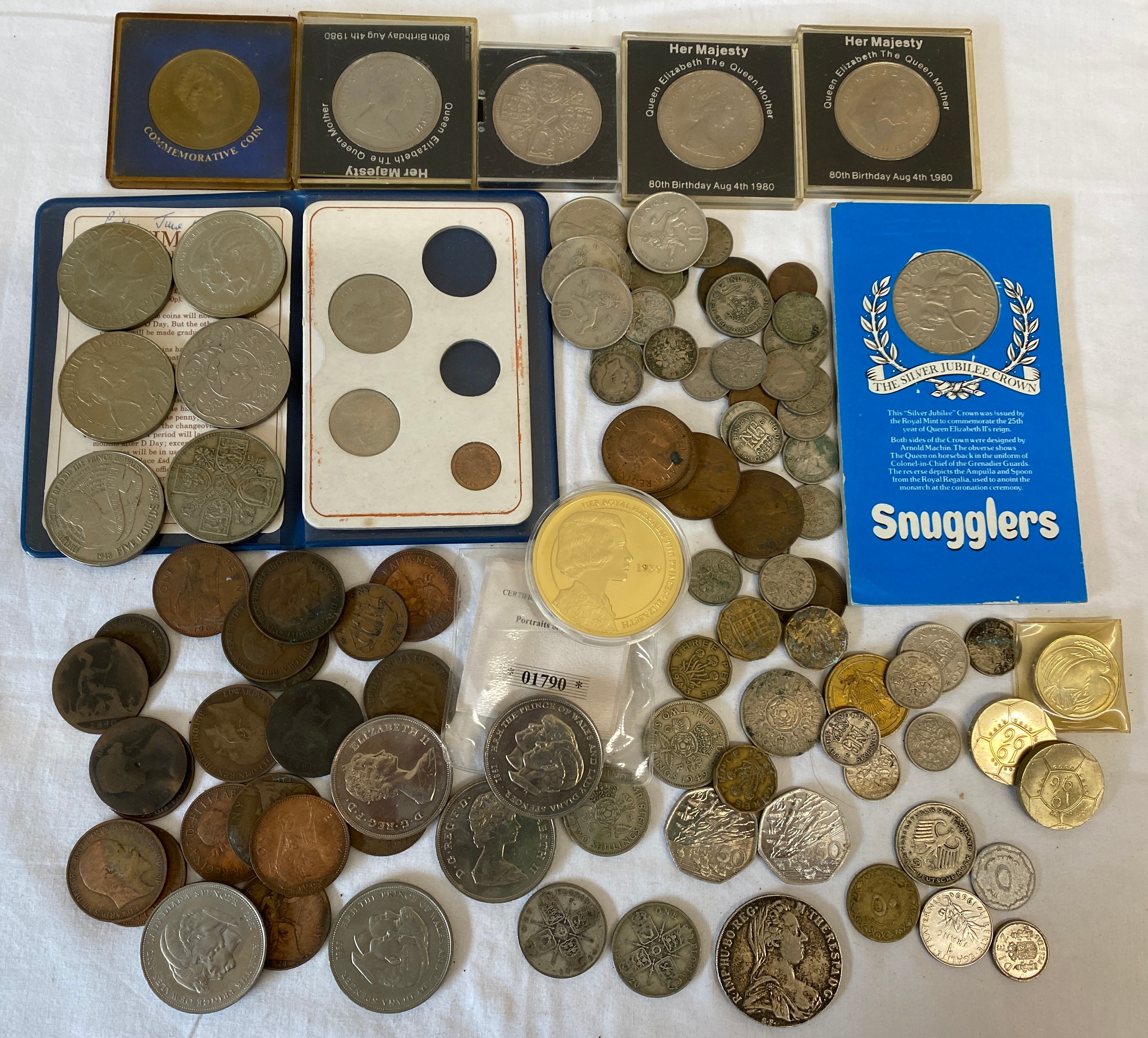 A collection of various coins to include Silver 1780 Maria Theresa Thaler coin, Two Florins 1919 and