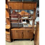 A mid century teak shelf unit. 107 w x 31 d x 177cm h.